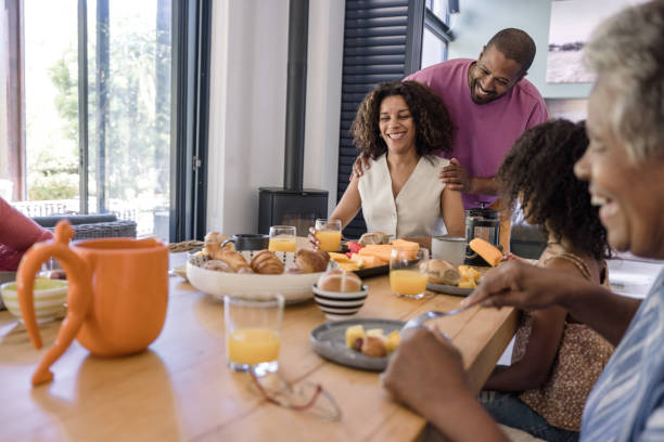 istock Smiling parents and children bonding over a nutritious breakfast. 2198439754