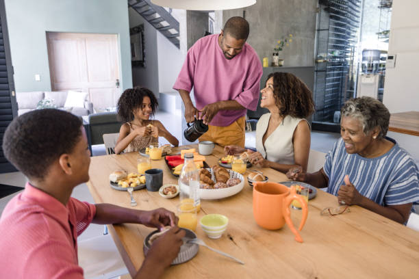istock Smiling parents and children bonding over a nutritious breakfast. 2198439762