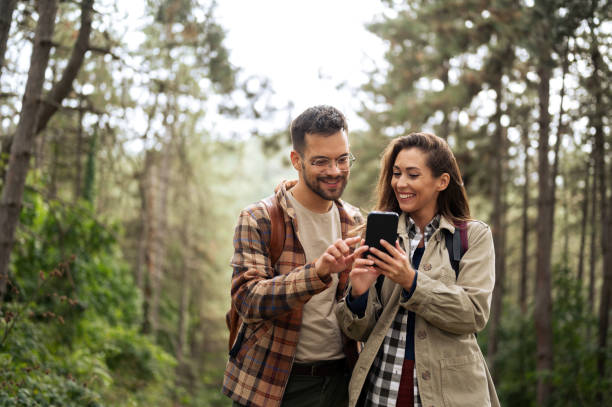 istock Beautiful young couple exploring nature 2198439852