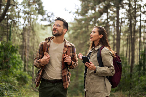 istock Beautiful young couple exploring nature 2198439866