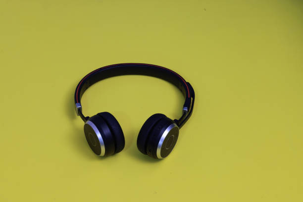 istock Object, modern headphones on the yellow background 2198441560