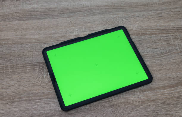 istock the Object Digital tablet with a Green screen and headphones in the working space 2198441596