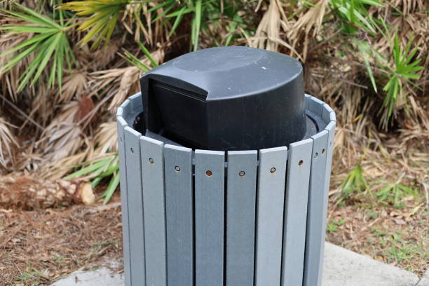 istock Wooden and plastic trash can in tropical public park 2198443830