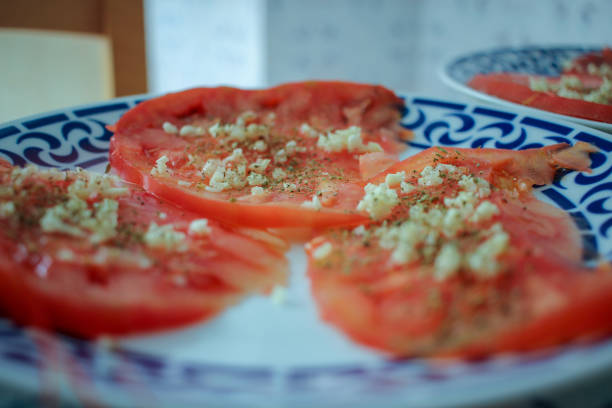 healthy slices of tomato with garlic and olive oil