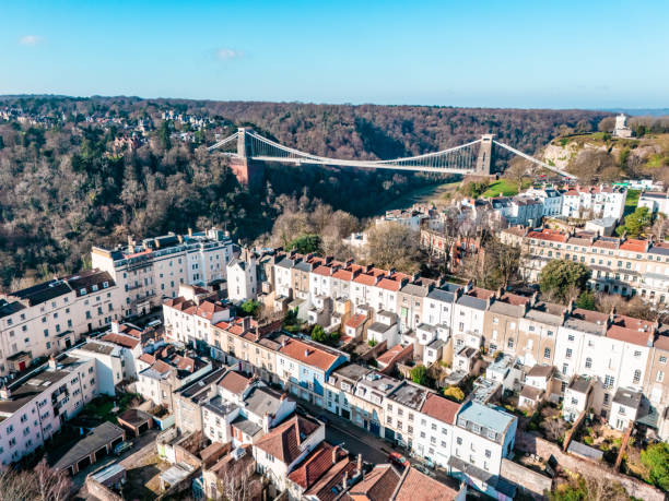A wide angle view of the Clifton Suspension Bridge spanning the Avon Gorge in the city of Bristol, England, UK.