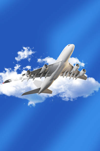 istock Commercial Airplane Taking Off into a Clear Blue Sky with White Clouds 2198453033