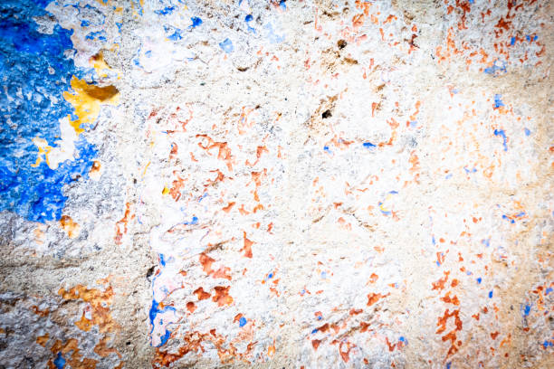 Coloured deteriorated wall surface revealing colours and texture