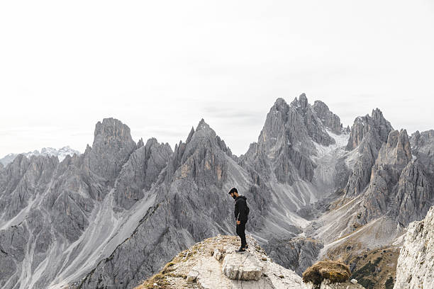 istock Hiker Standing on Rocky Ridge in the Dolomites 2198455692