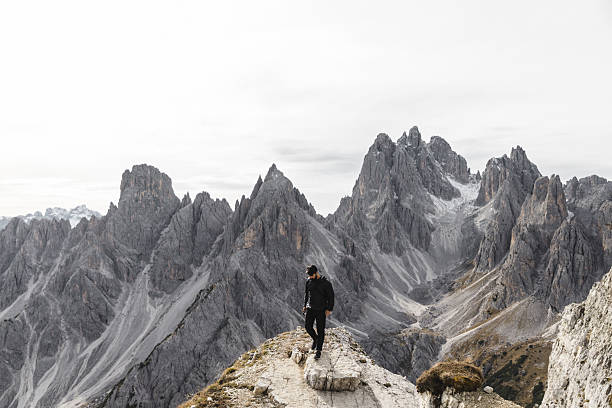 istock Hiker Standing on Rocky Ridge in the Dolomites 2198455705