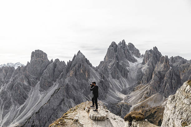 istock Hiker Standing on Rocky Ridge in the Dolomites 2198455724