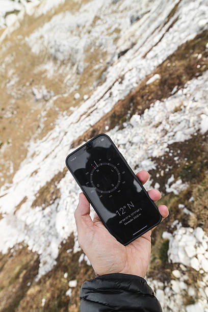 istock Hand Holding Smartphone Compass App in the Dolomites 2198456369