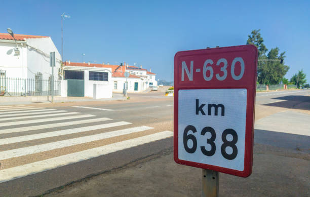 Badajoz, Spain - June 14th, 2018: 638 kilometer of Spanish National N-630 Road. Urban sing post