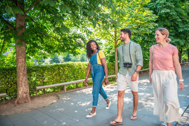 istock Diverse Friends on City Stroll in Sunlit Park 2198456602