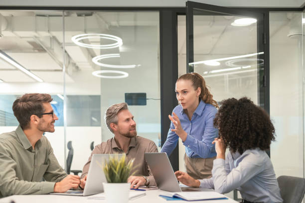 istock Business team discussing together business plans in office. 2198463313