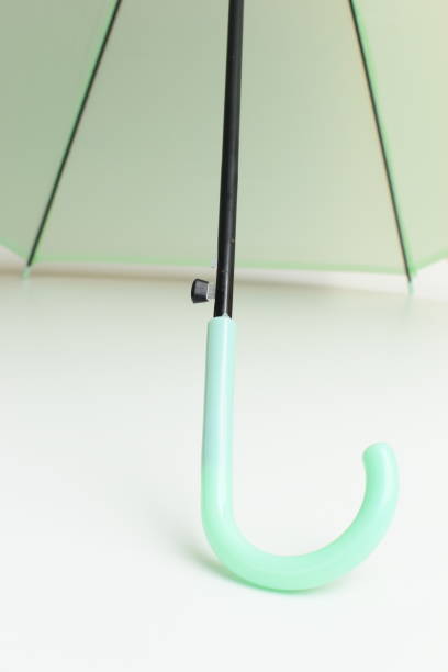istock handle of green umbrella isolated on white background 2198464447
