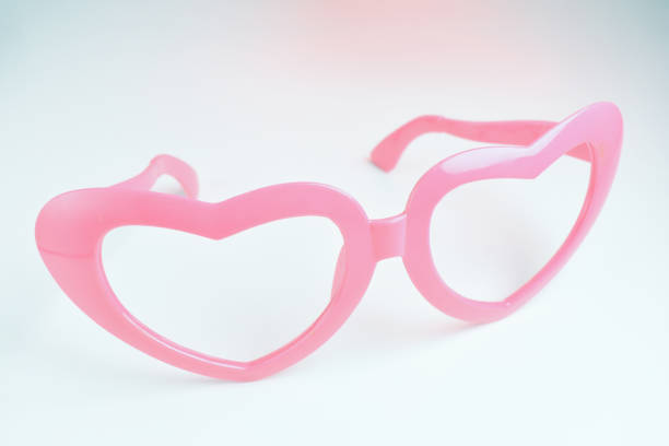 istock pink heart shape of glasses on white background 2198465681