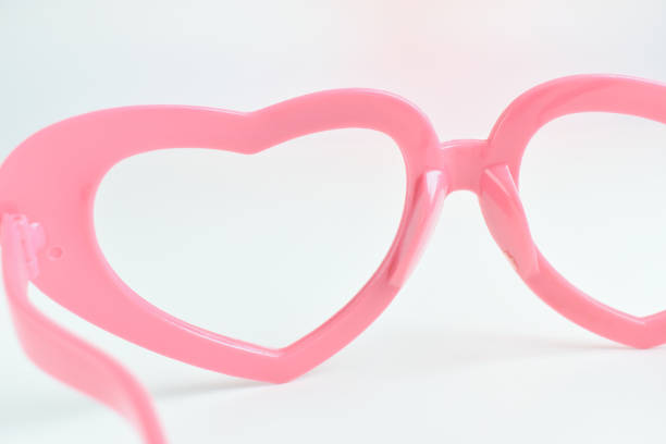 istock pink heart shape of glasses on white background 2198465682