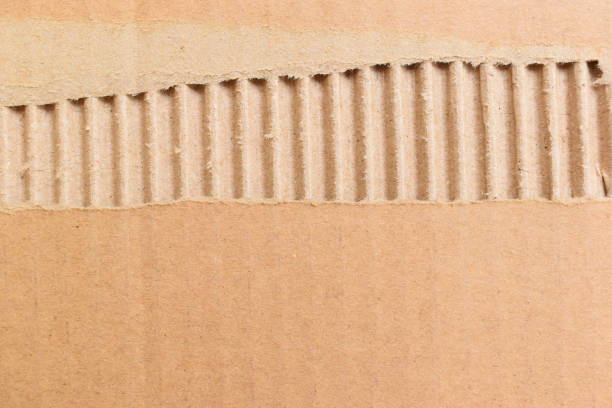 istock tear brown cardboard box texture background, recycle material 2198465778