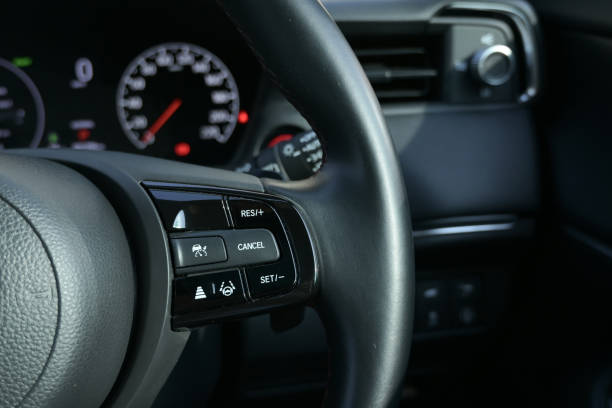 interior view of car with black leather, steering wheel with button