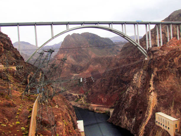 istock Hover Dam Bridge Hydroelectric Plant With Mountains 2198467778