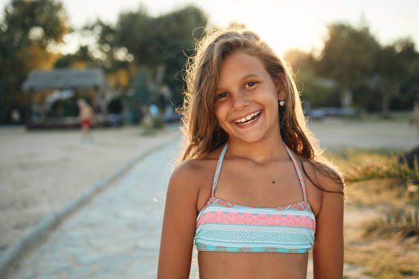 Beautiful girl enjoying sunset on a beach vacation.