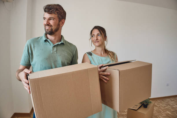 istock Couple moving into new home 2198479593
