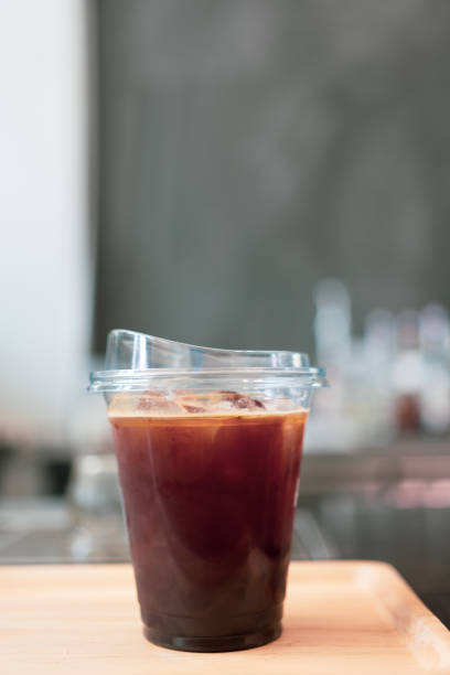 Iced black coffee americano in take away plastic cup.