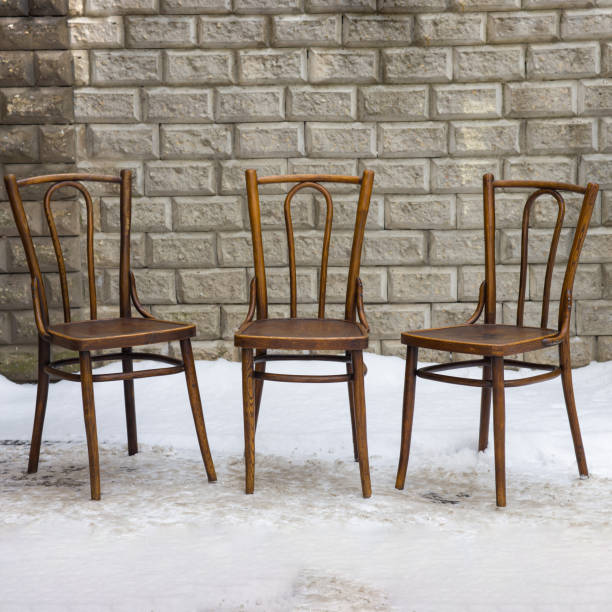 istock Three vintage bentwood chairs, elegantly crafted and finished in brown, 2198483216