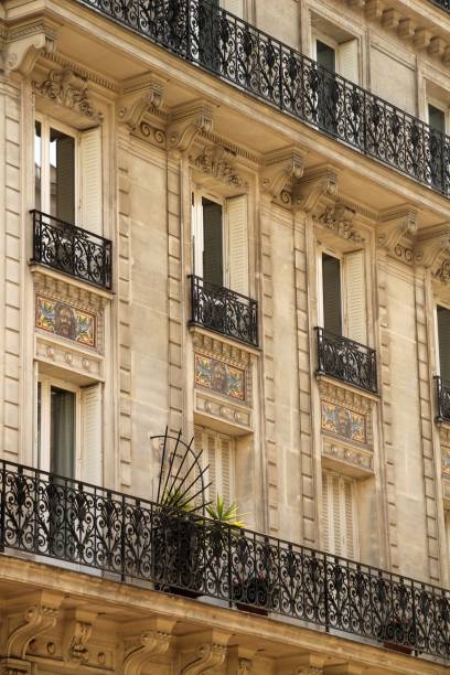 istock Parisian building facade with ornate balconies. 2198485132