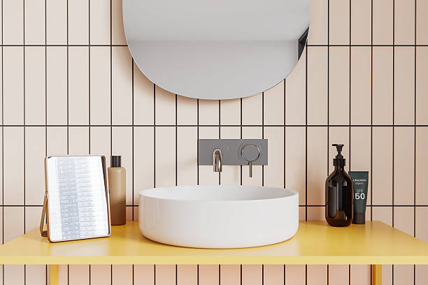 istock Modern bathroom with round mirrors and white sinks on wooden vanity against blue tiled wall. 3D Rendering 2198487428