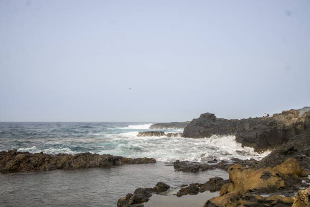 istock Waves crashing against a rocky shoreline in Gran Canaria. 2198488755