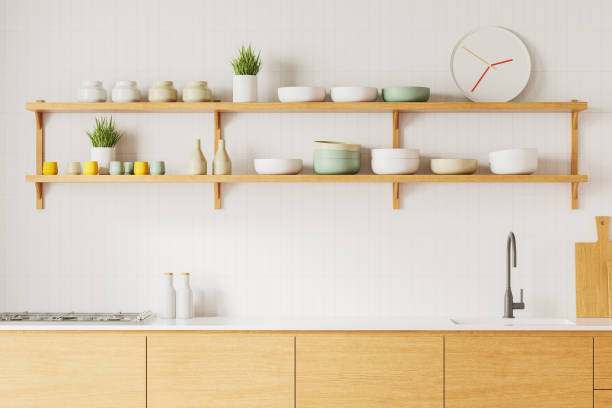 istock Modern minimalistic kitchen with white cabinets, large window, and wooden floor. 3D Rendering 2198489011