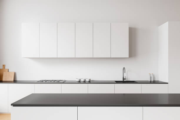 istock Modern minimalistic kitchen with white cabinets, large window, and wooden floor. 3D Rendering 2198489175
