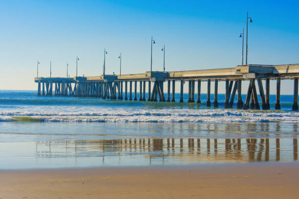 istock Venice Fishing Pier Reflected on Calm Waters 2198489691