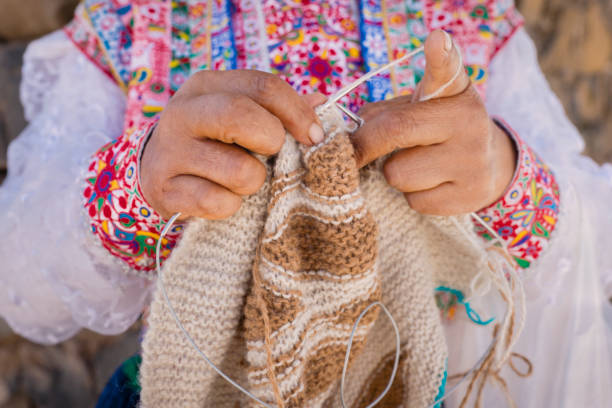 istock Peruvian woman knitting near Colca Canyon, Peru 2198490398