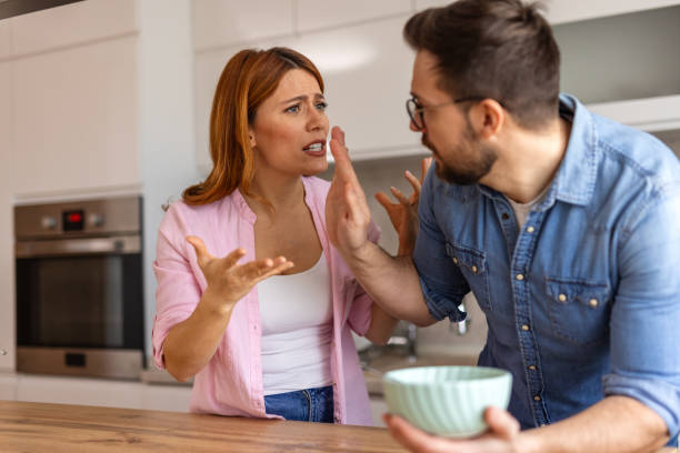 istock couple is having argument in the kitchen during breakfast. The scene reflects a moment of frustration and conflict, with both individuals visibly upset in a home setting. disagreement in everyday life 2198490641