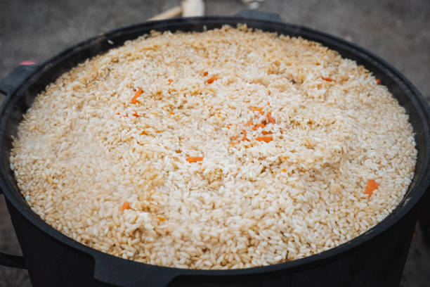istock In a sturdy pot, fluffy and perfectly cooked rice is held, artfully mixed with vibrant carrots, creating a dish that is visually stunning and perfect for any meal or special occasion 2198491123