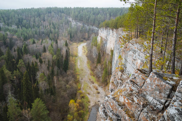 istock A picturesque river flows gracefully through a stunning valley that is beautifully surrounded by lush trees and rugged rocks, creating a serene and natural landscape to enjoy 2198491167