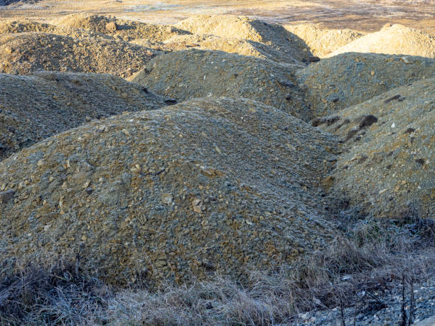 istock Piles of Excavated Soil and Rocks in a Construction or Mining Site 2198494944