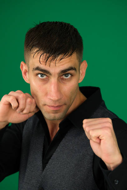 Young handsome male boxer fighter isolated on white background . High quality photo