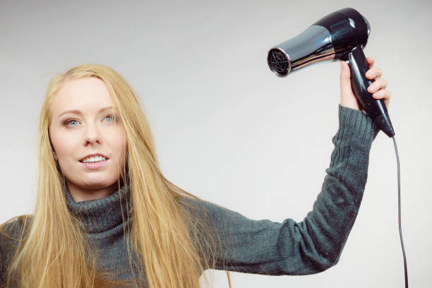 istock Woman styling her long hair 2198505009