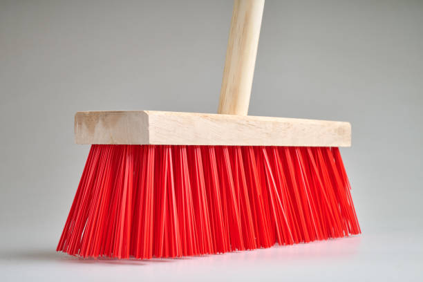 istock Clean Red street broom in studio light on white background 2198505028