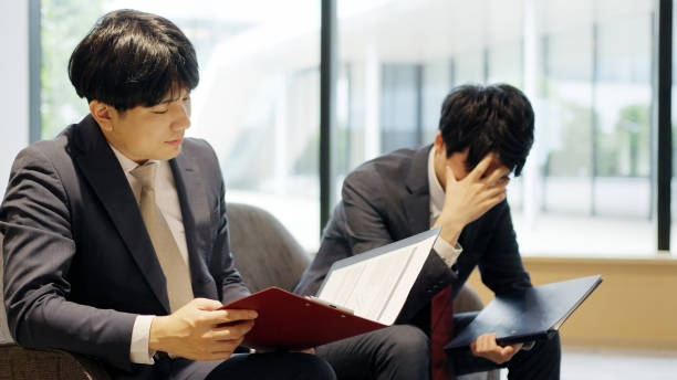 istock Asian businessman depressed at work 2198505059