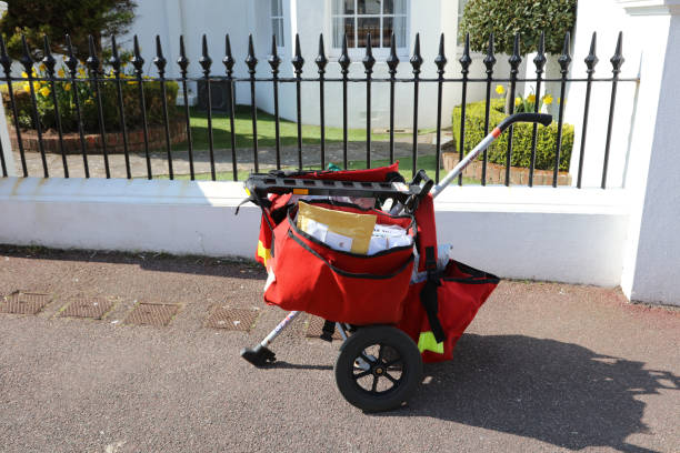 Eastbourne, United Kingdom - April 20, 2021: Messenger bag, Royal Mail push hand cart, Eastbourne, England