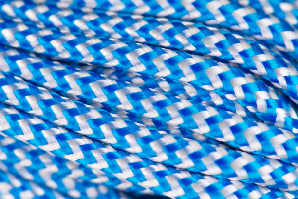 istock Pattern of blue rope made of synthetic polyester material close-up. Climbing equipment. 2198509366