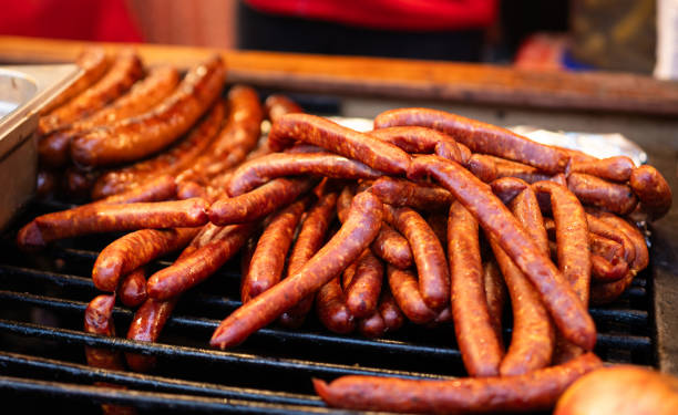 istock Fried Sausages On A Big Grill 2198509404