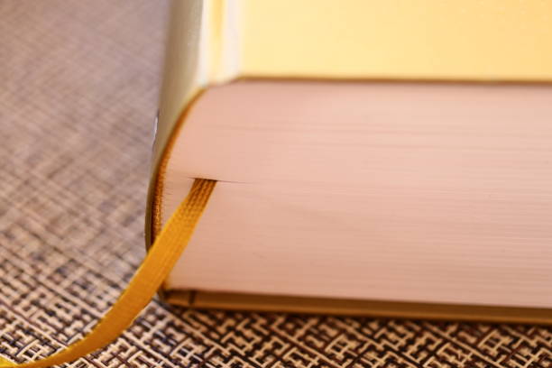 istock Book with yellow ribbon on cover 2198510218