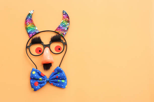 istock carnival, party and Purim celebration concept (jewish carnival holiday) over yellow background 2198511650