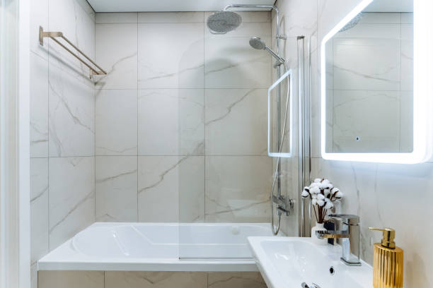 istock This modern minimalist bathroom design includes a stylish shower and luxurious bathtub, showcasing elegant fixtures and ambient lighting 2198512343