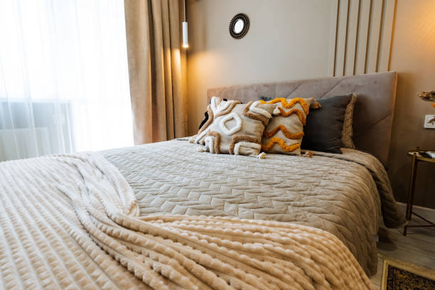 istock A cozy and modern bedroom featuring elegant bedding and decorative pillows that create a stylish and inviting atmosphere for relaxation 2198512358